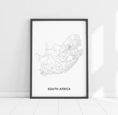 a black and white photo with the word south africa on it in front of a wall