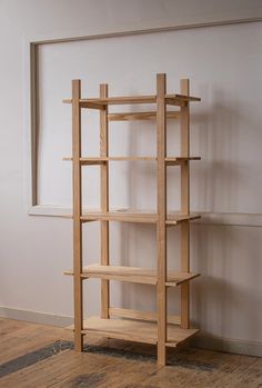 a wooden shelf sitting on top of a hard wood floor