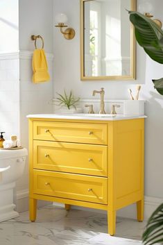 a bathroom with yellow furniture and white walls