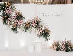 flowers and candles are arranged on the wall in front of a sign that says future & wed