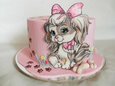 a pink cake with a dog on it