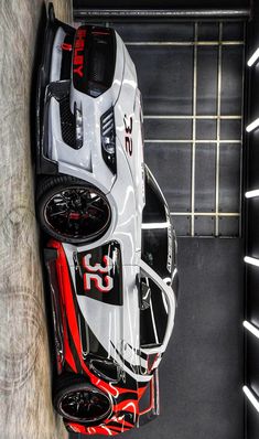 an overhead view of a car with red and white paint