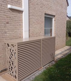 an outside view of a building with a wooden fence