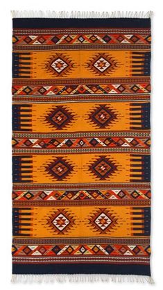 an orange and blue rug with fringes