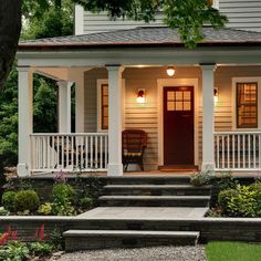 the front porch of a house with steps leading up to it