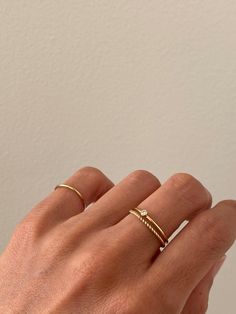 This dainty stacking ring is the perfect everyday ring. It's made of high quality gold-filled wire, making it hypoallergenic and perfect for sensitive skin. Wear this delicate ring alone or stack it with other rings.Details- Made of 1mm gold filled wire- Available in sizes 2 - 8- Custom size available - We make it in 14k solid gold Shop the look- Dainty Solitaire Ring- Dainty Twist Ring Feminine Rings Aesthetic, Ring Stack Minimalist, Daily Gold Rings, Simple Layered Rings, Gold Ring Set Simple, Mejuri Rings Stacking, Ring Stack Dainty, Stack Gold Rings, Gold Rings Delicate