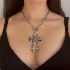 This silver gothic cross necklace showcases a large vintage cross pendant, reflecting grunge jewelry aesthetics, making it a bold statement piece perfect for her. It's an ideal religious jewelry gift idea for those who appreciate distinctive and edgy accessories. 𝐃𝐄𝐓𝐀𝐈𝐋𝐒:  ⭐️ Necklace length is 16" ⭐️ Pendant size is 3" ⭐️ The silver cross pendant is silver plated over alloy. The chain necklace is up on stainless steel, safe for those with sensitive skin ⭐️ The best statement necklace, Ap Big Cross Necklace, Big Silver Necklace, Gothic Cross Necklace, Big Cross, Grunge Jewelry, Edgy Accessories, Cross Necklaces, Gothic Cross, Gothic Crosses