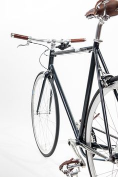 an old fashioned bicycle is shown against a white background