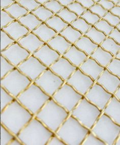 These wire mesh creates an all-purpose weave that will accommodate any application. Improve or create kitchen cabinets, hutches, curios and other furniture or project. Can be used both indoors and outdoors, Uses Include grills and home decorThese architectural meshes have a beautiful brass finish like no other.This unique wire top pattern adds visual texture and interest wherever it is used. The wires are crimped in such a way to create facets that collect and redirect light from all angles to allow the mesh to sparkle in its environment. Each side of the mesh has very different textures and either side can be showcased in an application.Dimensions Opening of mesh: 0.4370"Width of Wire: 0.0630"Overall Thickness of Wire; 0.1260"Weight/Square Foot: 0.2500 lbSamples 6" x 6"Full Size Mesh 24" Brass Furniture, Woven Furniture, Visual Texture, Knobs And Handles, Wire Mesh, Different Textures, Top Pattern, Brass Finish, Kitchen Cabinets