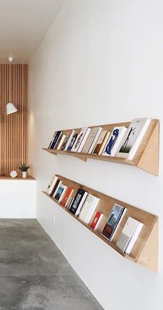 two bookshelves are on the wall in this room