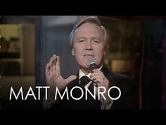 a man in a tuxedo holding a microphone with the words matt monro on it