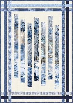 a blue and white quilt with trees in the snow on it's border,