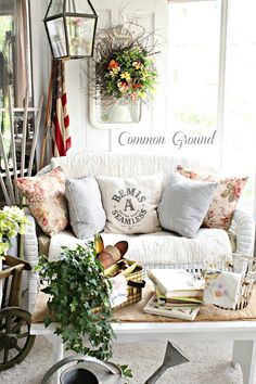 a living room filled with furniture and flowers