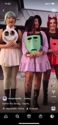 three women in costumes standing next to each other