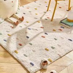 a child's play area with toys and rugs