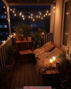 a porch with lights strung over it and some plants on the balcony table next to the couch