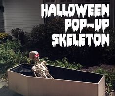 a skeleton sitting in a box with the words halloween pop - up skeleton on it