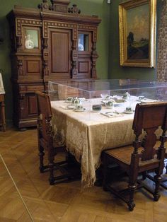 a dining room table is set with plates and cups