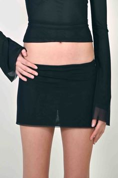 PREORDER: PLEASE ALLOW 2-3 MONTHS TO RECIEVE YOUR ITEM The Jane Micro Mini Skirt in Black Mesh is one of the newest additions to our Jane Collection. She features a double lined mesh with a micro mini length. Inspired by the 90's and 2000's she's the perfect skirt to style with the Jane Top or wear on its own. Stretchy and fitted Double lined mesh fabric Sizing Model is 5'9 and wearing size SMALL. Runs true to size. Care Machine wash cold. 100% Polyester (96% Polyester 4% Elastane) Micro Mini Skirt, Micro Mini, Equatorial Guinea, British Indian, Mozambique, Black Mesh, Brunei, Caribbean Netherlands, Mesh Fabric