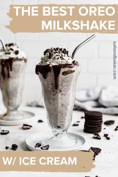 two ice cream sundaes with oreo cookies on the side and white brick wall behind them