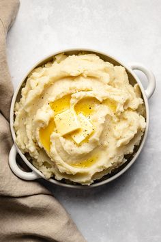 mashed potatoes with butter and seasoning in a bowl