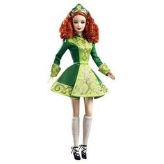 a doll with red hair wearing a green dress and white socks is standing in front of a white background