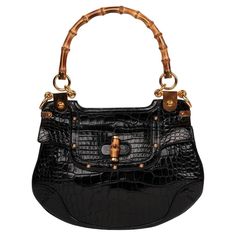 Gucci- Black Studded Shiny Alligator Leather Vintage Bamboo Top Handle Brand: Gucci Model: Bamboo Top Handle Shoulder Bag Product Type: Shoulder, Top Handle Serial Number: 15*********** Accompanied By: Gucci Dust Bag Colour: Black Hardware: Gold Material(s): Shiny Alligator Leather Authenticity Details: Serial Stamp Limited Edition: Yes Height- 22cm Width- 30cm Depth -2cm Handle Drop-15cm Interior- Beige Canvas Closure- Turn Lock Country of Origin- Italy CITES/Export Restrictions- Please note, t Number 15, Bamboo Top, Gucci Model, Gucci Models, Fashion Baby, Gucci Black, Black Hardware, Gold Material, Fashion Handbags