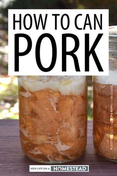 two jars filled with food sitting on top of a wooden table next to each other