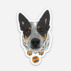 a dog sticker with an orange ball in the foreground and a black and white dog's head