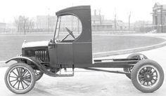 an old black and white photo of a car