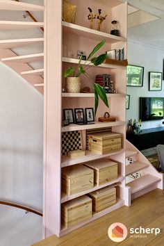 a living room filled with furniture next to a stair case