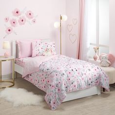 Create a cozy, inviting space for your child with this lovely watercolor floral twin size bed set. It includes one twin size quilt and one standard pillow sham. The watercolor floral print is in soft shades of pinks and grays and the quilt is 68” X 86”. The coordinating pillow sham is in a luxurious, soft pink minky fabric and is 23” X 29”. Mini Crib Bedding, Blossom Watercolor, Twin Size Quilt, Wall Decor Storage, Twin Size Bed, Twin Quilt Size, Toddler Bed Set, Mini Crib Sheets, Sham Bedding