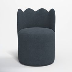 a grey chair with scalloped backrest and foot rest in front of a white background