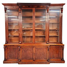 an old wooden china cabinet with glass doors