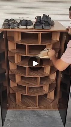 a man standing next to a wooden shoe rack