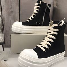 Elevate your footwear game with our exceptional collection of Rick Owens Unisex Shoes! Introducing the epitome of style and comfort, these SBlack genuine  HI tops Rick Owens sneakers are a must-have addition to any fashion-conscious individual's wardrobe. Embrace the trendsetting elegance and versatility that these sneakers bring to your ensemble. Key Features: Heel Height: With a flat sole (≤1cm to 3cm )Please these sneakers offer unparalleled comfort, making them perfect for all-day wear. Perfect Fit: Our sneakers are designed to fit true to size, ensuring a comfortable fit that embraces your feet. Take your normal size for the perfect fit. Lining Material: Crafted with high-quality canvas, these sneakers offer breathability and a soft interior, enhancing your overall comfort. Season: Id Platform High-top Sneakers For Streetwear, Platform Canvas Shoes With Round Toe For Streetwear, Streetwear Platform Canvas Shoes With Round Toe, Streetwear Canvas Shoes With Platform And Flat Heel, Flat Heel Platform Canvas Shoes For Streetwear, Ankle-high Platform Canvas Shoes For Streetwear, Platform Canvas Shoes With Flat Heel For Streetwear, Streetwear High-top Platform Sneakers, Flat Heel Platform High-top Sneakers For Streetwear