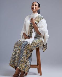 This Shimena Habesha dress is a true masterpiece that combines traditional elegance with modern style. The dress features an intricate pattern that is carefully crafted to create a stunning visual effect. The pattern is complemented by a beautiful Tibeb design, which adds a touch of traditional charm to the overall design. The dress is designed to fit comfortably and flatteringly, with a fitted bodice and a full skirt that flows beautifully as you move. The dress is made with high-quality fabric Eritrean Dress, Ethiopian Clothing, Habesha Dress, Ethiopian Traditional Dress, Ethiopian Dress, Habesha Kemis, Cultural Events, Jan 11, Full Skirt