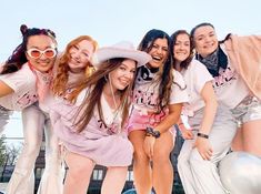 a group of young women standing next to each other