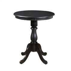 a small black table sitting on top of a white floor