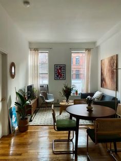 a living room filled with furniture and wooden floors