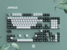 an image of a computer keyboard made out of black and white keys on a green background