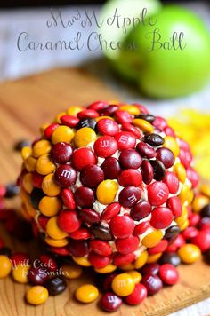 candy apple caramel cheesy ball on a cutting board