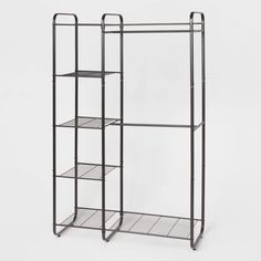 an iron rack with three shelves on each side and one shelf in the middle, against a white background