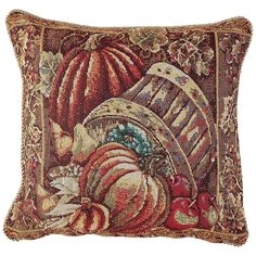 a decorative pillow with an image of pumpkins and gourds