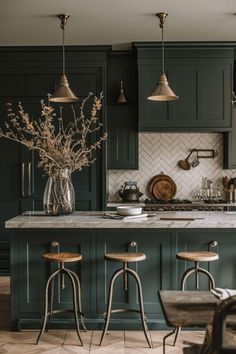 a kitchen with green cabinets and wooden stools