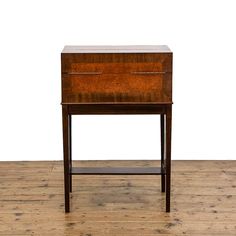 a small wooden table with two drawers on one side and an open drawer on the other