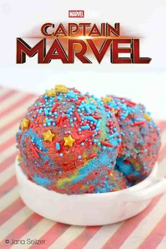 captain marvel cupcakes in a bowl with sprinkles on top and the title