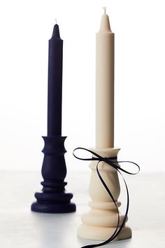 two candles tied to each other on a table