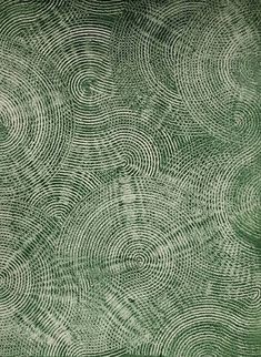 a green and white background with swirls in the shape of an abstract design on it