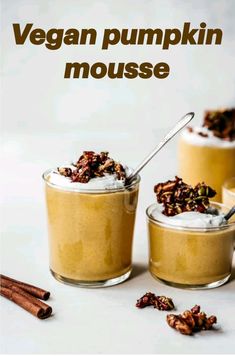 vegan pumpkin mousse in small glass jars with cinnamon sticks on the side